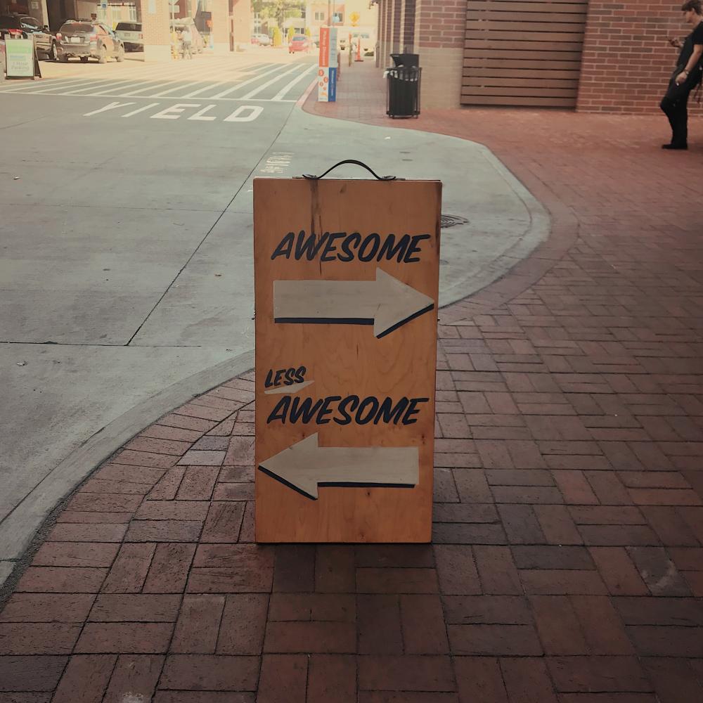 photo of a sign that says awesome / not awesome